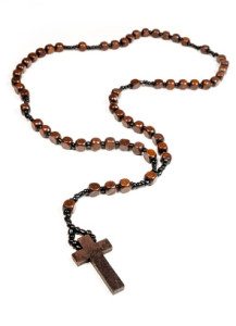 Wooden rosary beads and cross isolated on a white background.