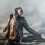 Man looking at stormy sky