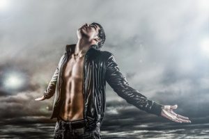 Man looking at stormy sky