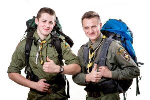 Two young scout boys with sleeping bag and backpack