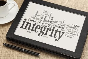 cloud of words or tags related to integrity and ethical values on a digital tablet