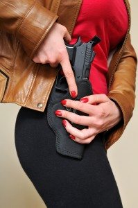  Woman holding Gun Holster.