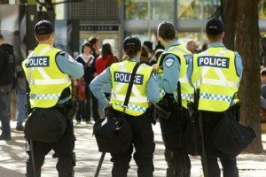 Police officers watching crowd